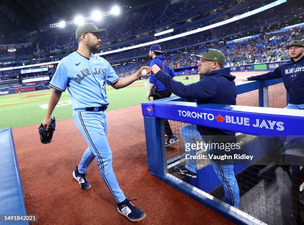 Yusei Kikuchi of the Toronto Blue Jays walks into the dugout prior to a game against the Baltimore Orioles at Rogers Centre on May 19, 2023 in...