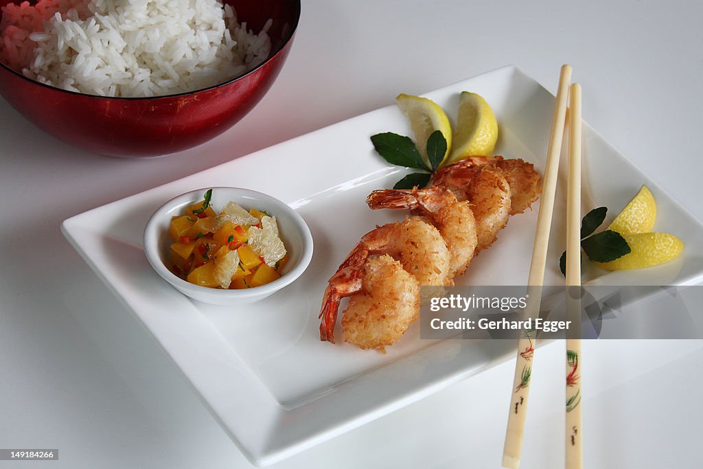 Coconut prawns with chopsticks