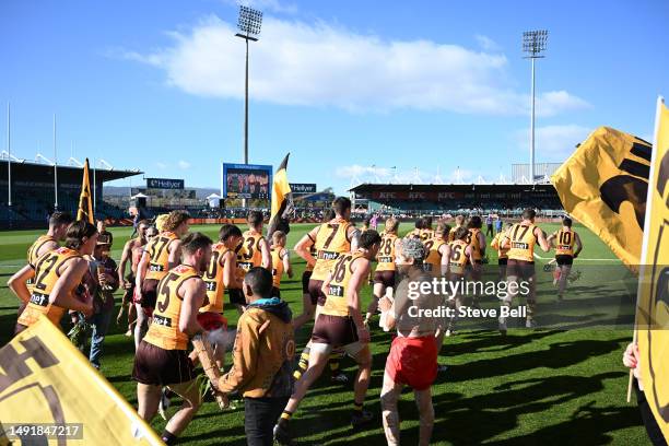 Hawthorn players take the field during the round 10 AFL match between Hawthorn Hawks and West Coast Eagles at University of Tasmania Stadium, on May...