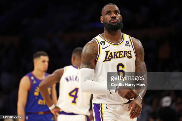 LeBron James of the Los Angeles Lakers reacts after missing a shot during the fourth quarter against the Denver Nuggets in game three of the Western...