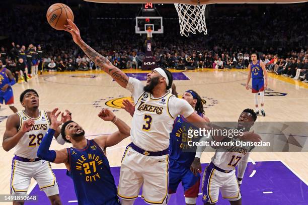 Anthony Davis of the Los Angeles Lakers goes for a rebound against Jamal Murray of the Denver Nuggets in game three of the Western Conference Finals...
