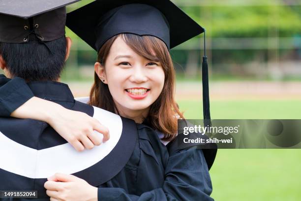 with anticipation of their impending graduation, the beaming graduates direct their gaze towards the camera, ready to bid farewell to the campus and embark on their professional journeys. - impending stock pictures, royalty-free photos & images