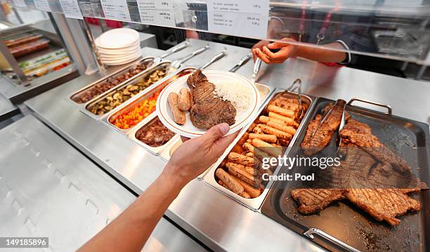 An athlete waits to be served in the main dining hall inside the Olympic Village on July 24, 2012 in London, England.