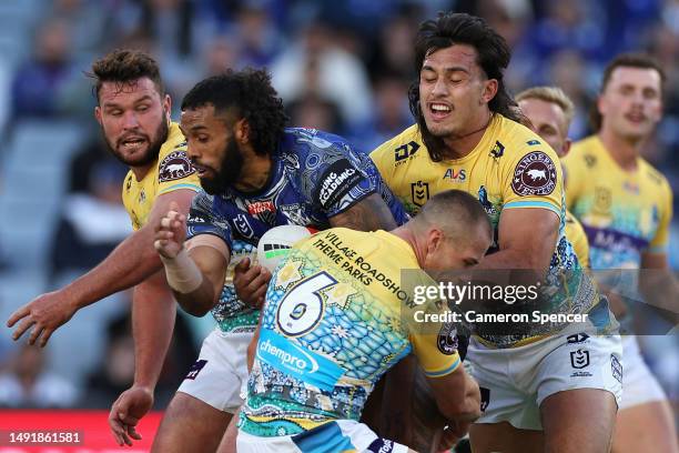 Josh Addo-Carr of the Bulldogs is tackled during the round 12 NRL match between Canterbury Bulldogs and Gold Coast Titans at Accor Stadium on May 21,...