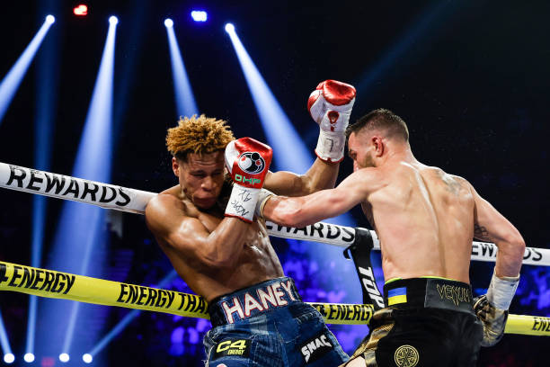 Devin Haney exchanges punches with Vasyl Lomachenko of Ukraine during their undisputed lightweight title bout at MGM Grand Garden Arena on May 20,...