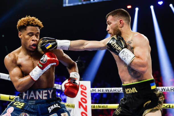 Devin Haney exchanges punches with Vasyl Lomachenko of Ukraine during their undisputed lightweight title bout at MGM Grand Garden Arena on May 20,...