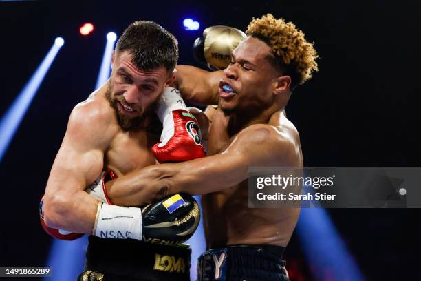 Devin Haney exchanges punches with Vasyl Lomachenko of Ukraine during their undisputed lightweight title bout at MGM Grand Garden Arena on May 20,...