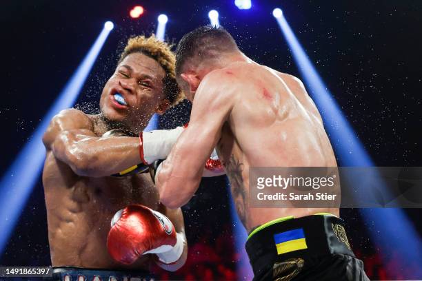 Devin Haney is punched by Vasyl Lomachenko of Ukraine during their undisputed lightweight title bout at MGM Grand Garden Arena on May 20, 2023 in Las...