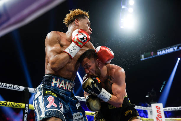 Devin Haney exchanges punches with Vasyl Lomachenko of Ukraine during their undisputed lightweight title bout at MGM Grand Garden Arena on May 20,...