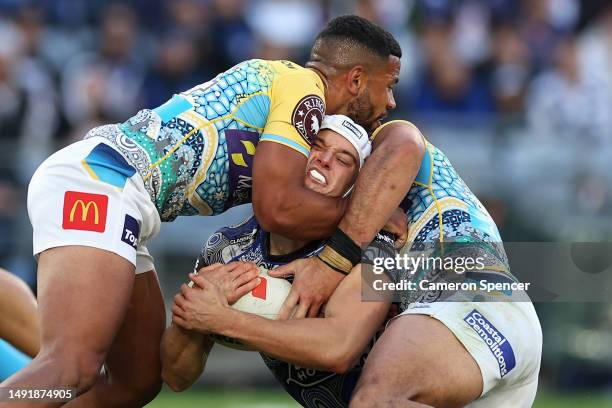 Blake Wilson of the Bulldogs is tackled during the round 12 NRL match between Canterbury Bulldogs and Gold Coast Titans at Accor Stadium on May 21,...