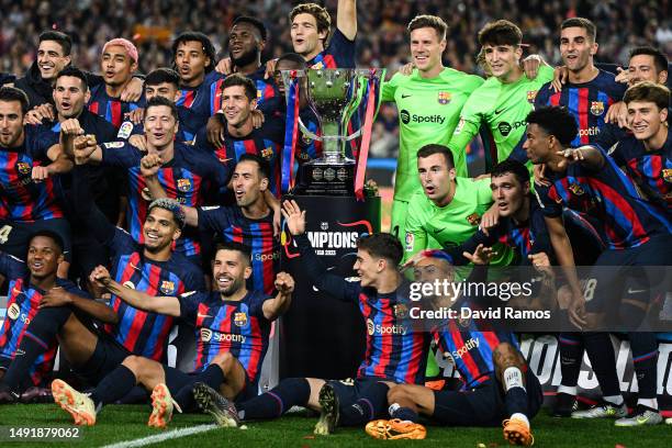 Players of FC Barcelona celebrate next to LaLiga Santander trophy after being crowned League Champions after the LaLiga Santander match between FC...