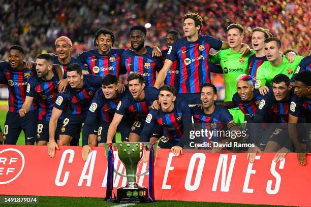 Players of FC Barcelona celebrate next to LaLiga Santander trophy after being crowned League Champions after the LaLiga Santander match between FC...