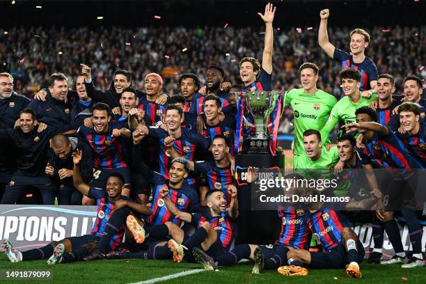 Players of FC Barcelona celebrate next to LaLiga Santander trophy after being crowned League Champions after the LaLiga Santander match between FC...