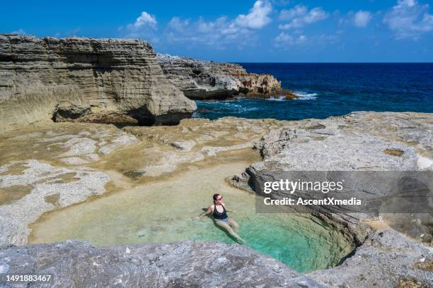 aerial view of woman  enjoying tidal pools at seaside - clouds transparent stock pictures, royalty-free photos & images