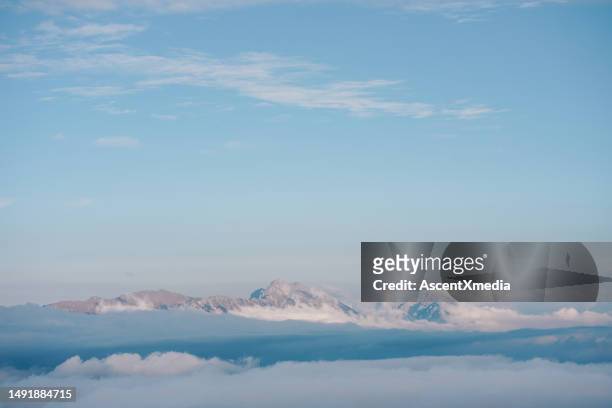 snowcapped mountains in early morning light - haute savoie stockfoto's en -beelden