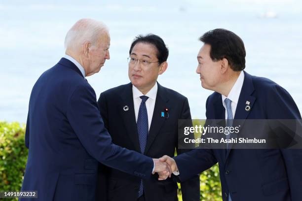 President Joe Baden, Japanese Prime Minister Fumio Kishida and South Korean President Yoon Suk Yeol talk during a photo session prior to the...