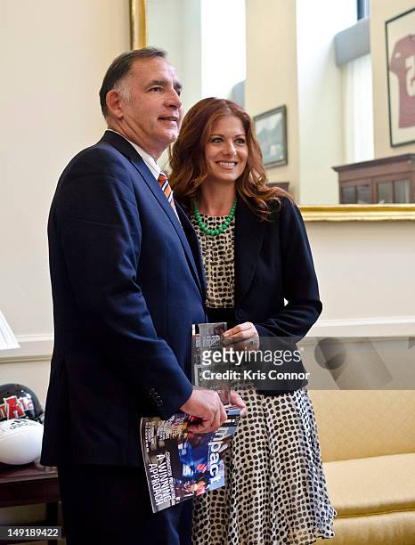 John Boozman is presented with an award by Debra Messing during the 19th International AIDS conference in the Hart Senate Office building on July 24,...