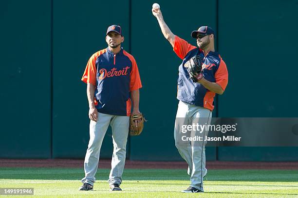 Newly acquired players Omar Infante and Anibal Sanchez of the Detroit Tigers shag balls in the outfield during batting practice prior to the game...