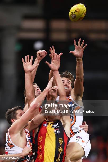 Jesse Hogan and Aaron Cadman of the Giants contests the ball against Rowan Marshall of the Saints during the round 10 AFL match between Greater...