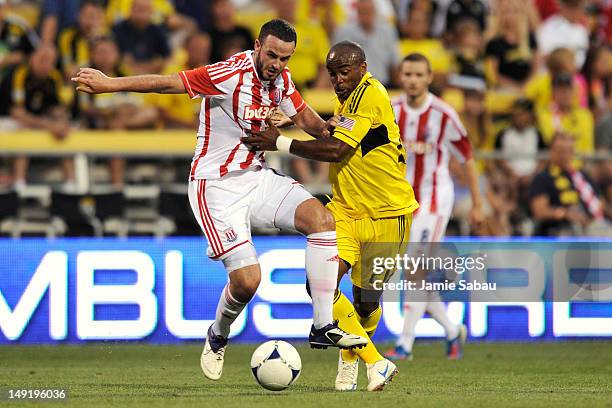 Marc Wilson of Stoke City FC and Emilio Renteria of the Columbus Crew battle for control of the ball in the second half on July 24, 2012 at Crew...