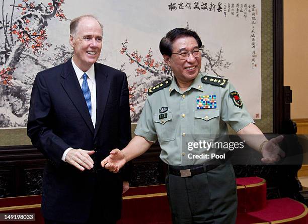 National Security Advisor Tom Donilon chats with China Central Military Commission Vice Chairman General Xu Caihou before their meeting at the...