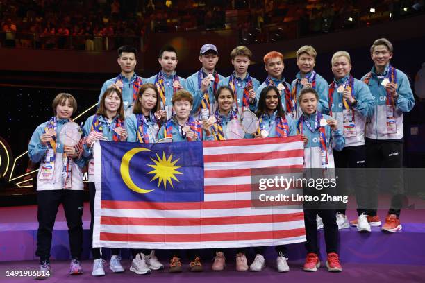 Bronze medal team of Malaysia celebrates during the awards ceremony after the Sudirman Cup 2023 at Suzhou Olympic Sports Center Gymnasium on May 21,...