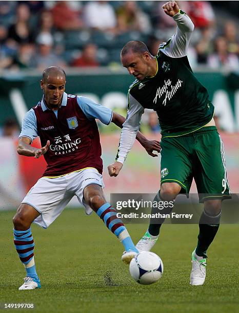 Karim El Ahmadi of Aston Villa battles Kris Boyd of the Portland Timbers at Jeld-Wen Field on July 24, 2012 in Portland, Oregon.