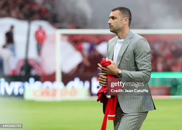 Former player of Lille Burak Yilmaz kicks off the Ligue 1 Uber Eats match between Lille OSC and Olympique de Marseille at Stade Pierre-Mauroy on May...