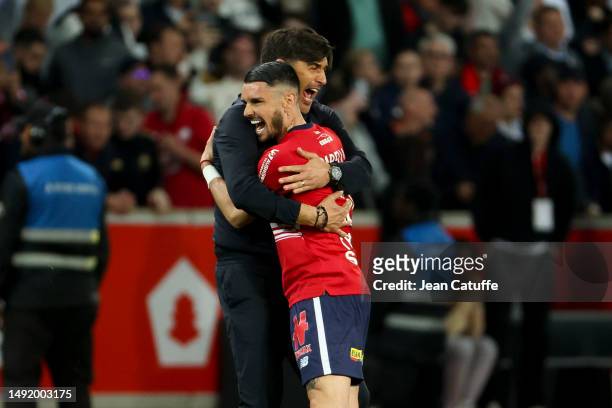 Coach of Lille OSC Paulo Fonseca celebrates the victory with Remy Cabella following the Ligue 1 Uber Eats match between Lille OSC and Olympique de...