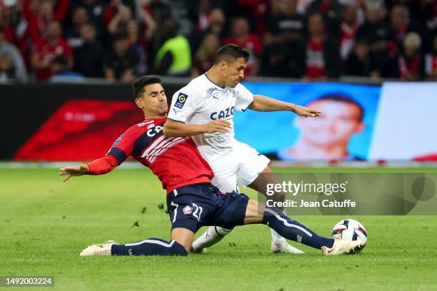 Alexis Sanchez of Marseille, left Benjamin Andre of Lille during the Ligue 1 Uber Eats match between Lille OSC and Olympique de Marseille at Stade...