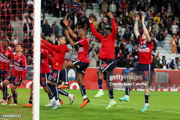 Players of Lille celebrate the victory with their supporters following the Ligue 1 Uber Eats match between Lille OSC and Olympique de Marseille at...