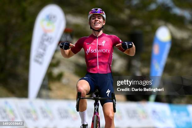 Demi Vollering of The Netherlands and Team SD Worx - Pink UCI Women’s WorldTour Leader Jersey celebrates at finish line as stage winner competes...