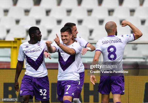 Luka Jovic of ACF Fiorentina celebrates with teammates after scoring the team's first goal during the Serie A match between Torino FC and ACF...