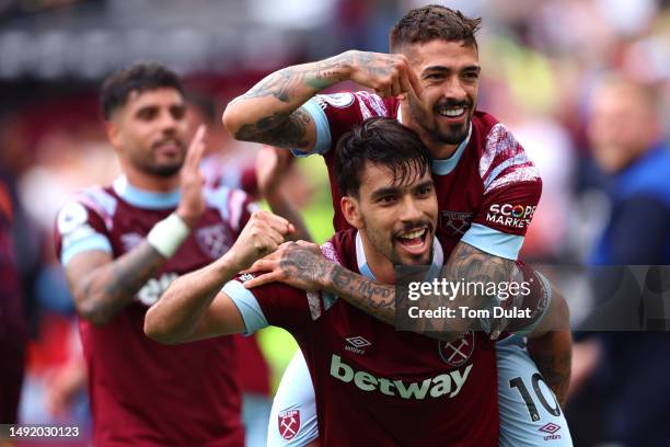 Manuel Lanzini of West Ham United celebrates with teammate Lucas Paqueta after scoring the team's third goal during the Premier League match between...