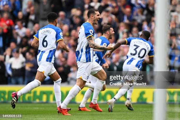 Lewis Dunk of Brighton & Hove Albion celebrates after the team's third goal scored by teammate Pascal Gross during the Premier League match between...