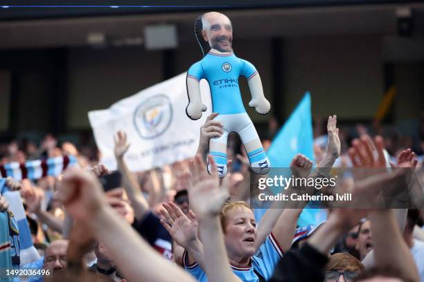 Blow up cut out of Pep Guardiola, Manager of Manchester City, is displayed by a fan prior to the Premier League match between Manchester City and...