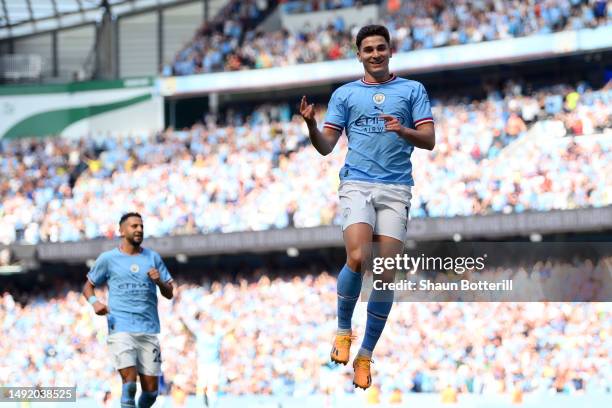 Julian Alvarez of Manchester City celebrates after scoring the team's first goal during the Premier League match between Manchester City and Chelsea...