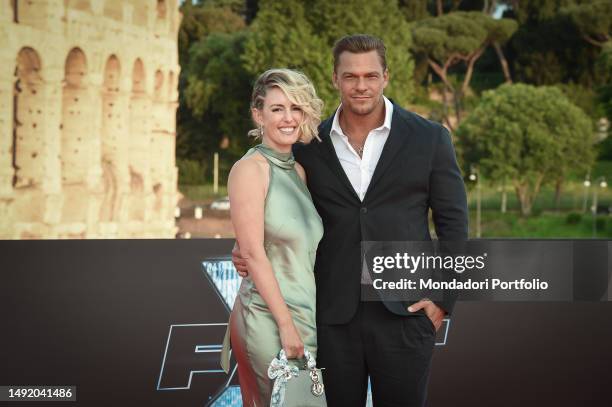 American actor and singer Alan Ritchson with his wife Catherine Ritchson, American writer and producer, on the red carpet at the world premiere of...