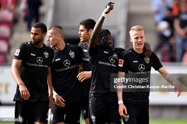 Tanguy Coulibaly of VfB Stuttgart celebrates with teammate Chris Fuehrich after scoring the team's fourth goal during the Bundesliga match between 1....