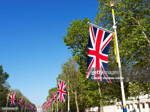 display of british flags - the mall london stock pictures, royalty-free photos & images