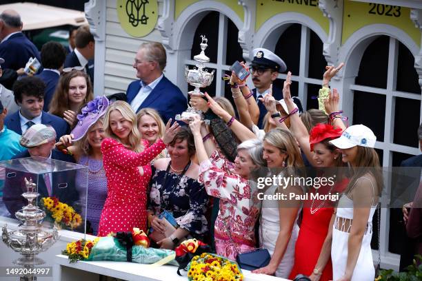 Celebrating with a winning trophy during Preakness 148 Hosted By 1/ST at Pimlico Race Course on May 20, 2023 in Baltimore, Maryland.