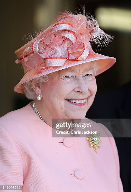 Queen Elizabeth II smiles as she visit Cowes Lifeboat Station during her Diamond Jubilee visit to the Isle of Wight on July 25, 2012 in Cowes,...