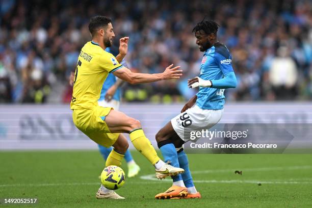 Roberto Gagliardini of FC Internazionale and Andre-Frank Zambo Anguissa of SSC Napoli battle for the ball during the Serie A match between SSC Napoli...