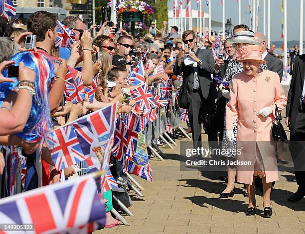 Queen Elizabeth II meets locals during her Diamond Jubilee visit to the Isle of Wight on July 25, 2012 in Cowes, England. The Queen and Duke of...