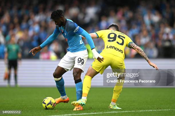 Andre-Frank Zambo Anguissa of SSC Napoli and Alessandro Bastoni of FC Internazionale battle for the ball during the Serie A match between SSC Napoli...