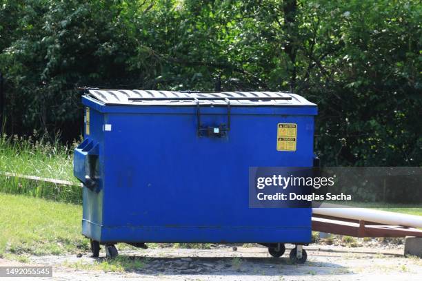 trash and refuse dumpster for recycling and waste removal - müllcontainer stock-fotos und bilder