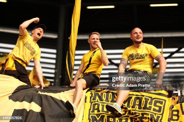 Fans of Borussia Dortmund show their support during the Bundesliga match between FC Augsburg and Borussia Dortmund at WWK-Arena on May 21, 2023 in...