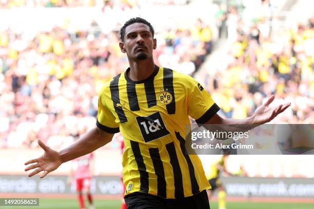 Sebastien Haller of Borussia Dortmund celebrates after scoring the team's first goal during the Bundesliga match between FC Augsburg and Borussia...