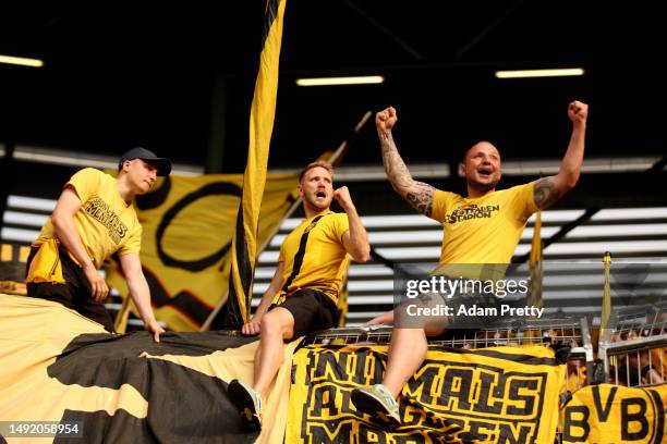 Fans of Borussia Dortmund show their support during the Bundesliga match between FC Augsburg and Borussia Dortmund at WWK-Arena on May 21, 2023 in...