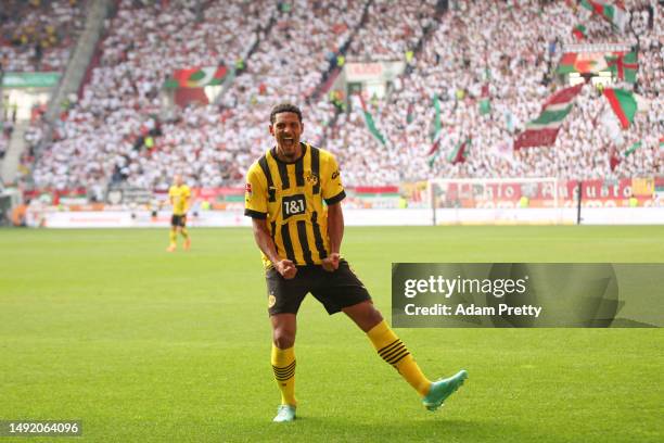 Sebastien Haller of Borussia Dortmund celebrates after scoring the team's second goal during the Bundesliga match between FC Augsburg and Borussia...